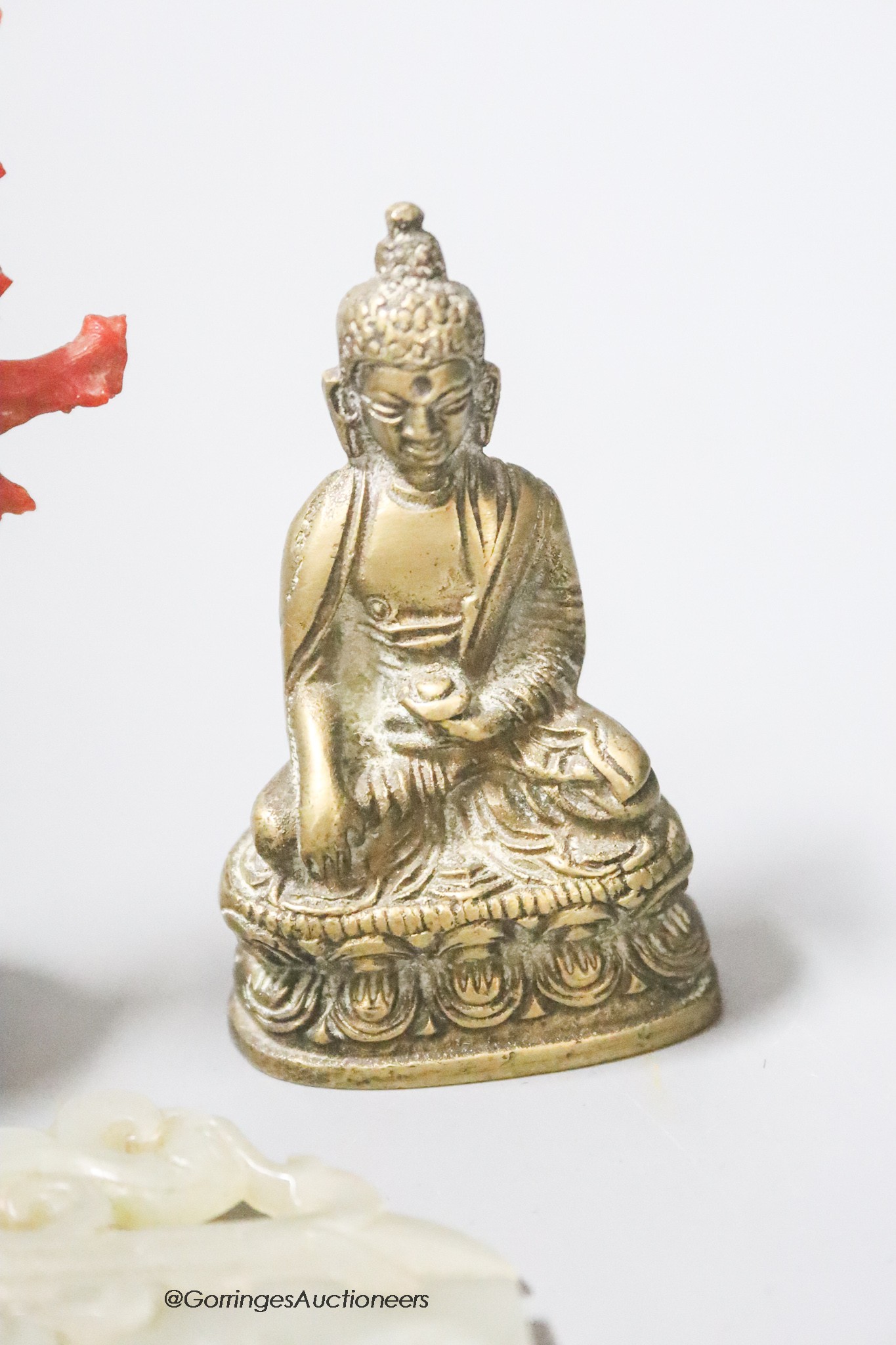 A coral and ivory miniature carving, height 9cm, a Buddha and a carved jade plaque